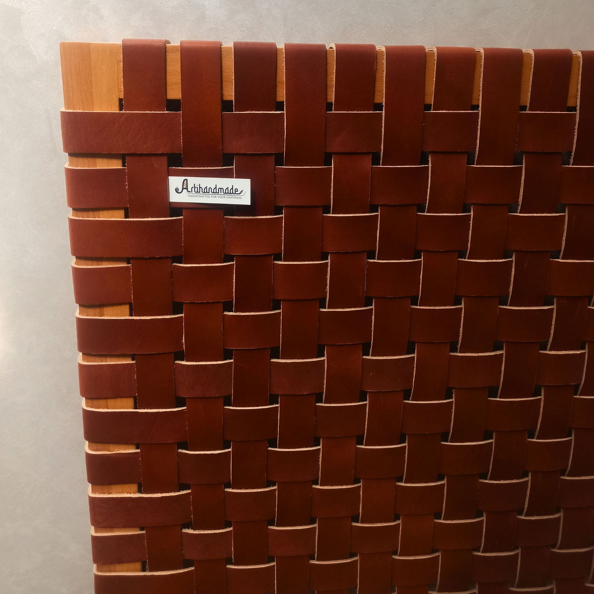 Rustic Wood Headboard with leather accents, a unique centerpiece for a cozy bedroom.