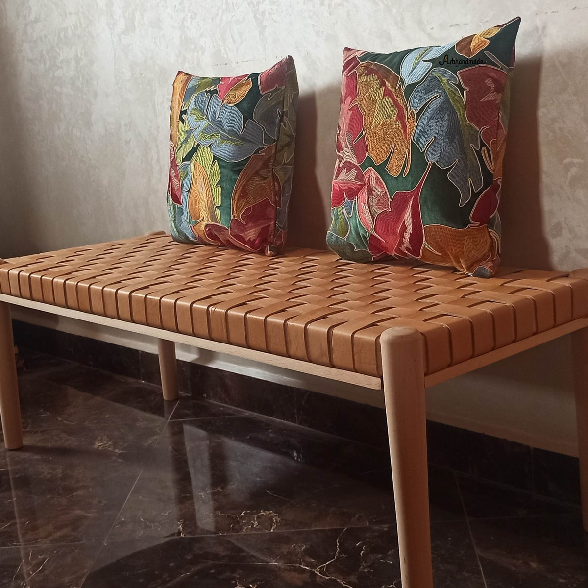 Close-up of Helga Entryway Bench showcasing the luxurious beige strap leather upholstery