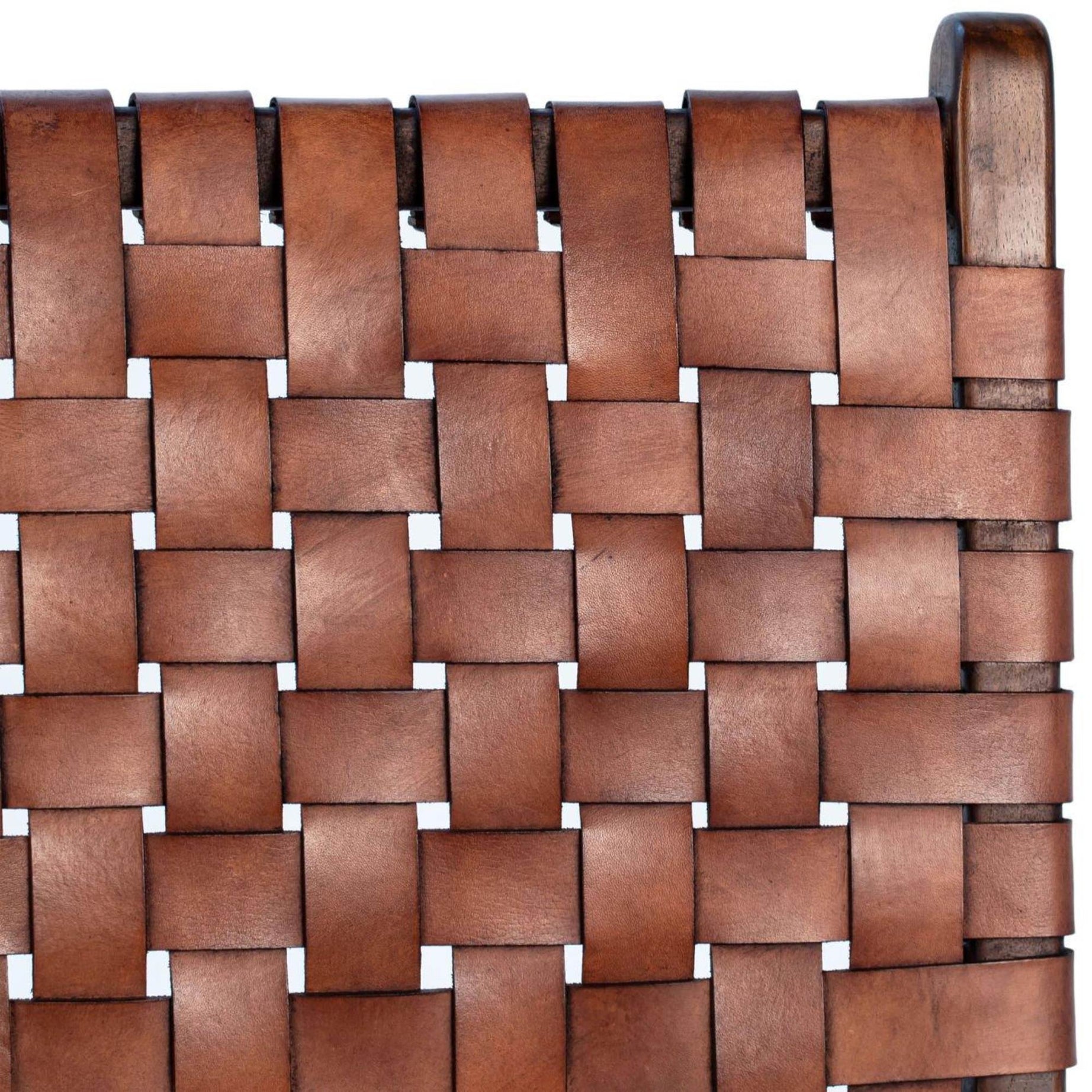 Handwoven top-grain leather seat of Ljus dining chair, showing intricate texture.
