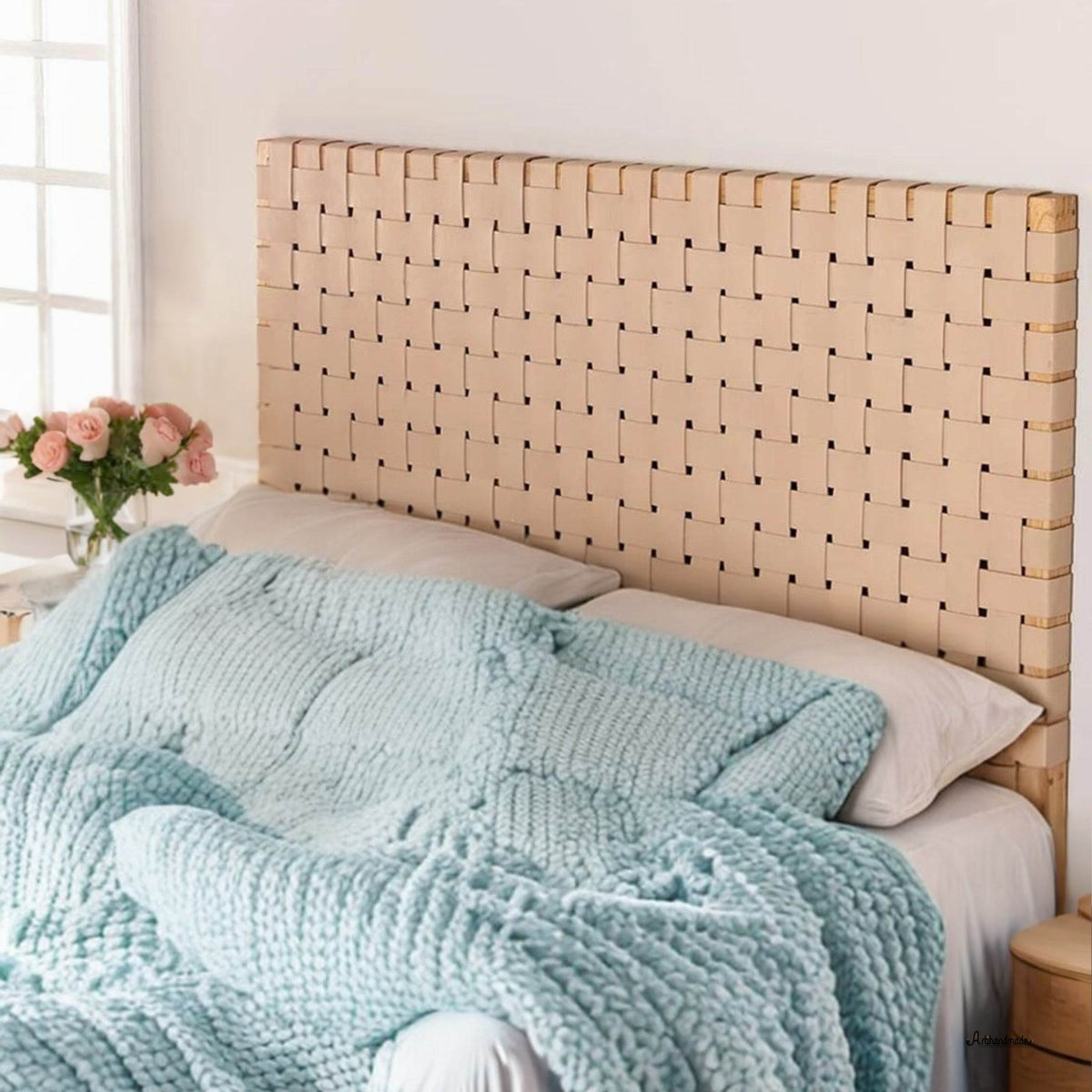 Front view of handcrafted leather and wood headboard on queen bed