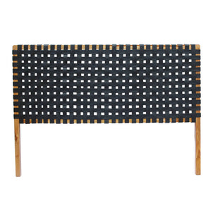 Close-up shot of the leather straps on a classic headboard detailing the fine weaving technique