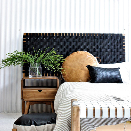 Classic strap woven leather headboard styled in a modern bedroom