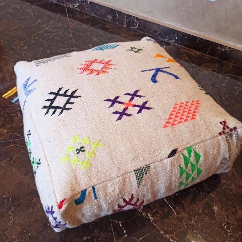 Vintage-look Kilim ottomans, sold as a set of two.